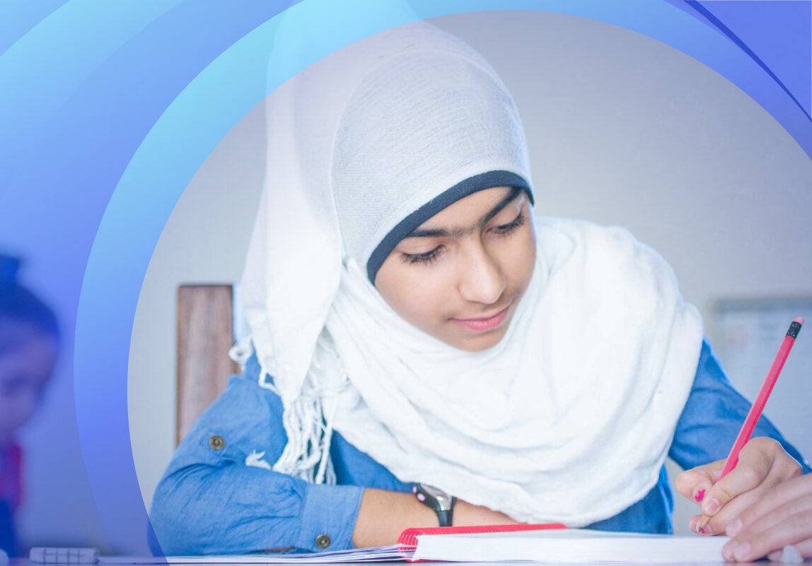 Girl with hijab writing