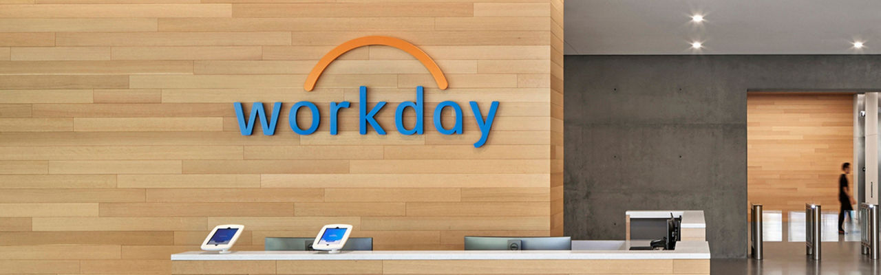 The front desk of the Workday offices with the Workday logo on wall