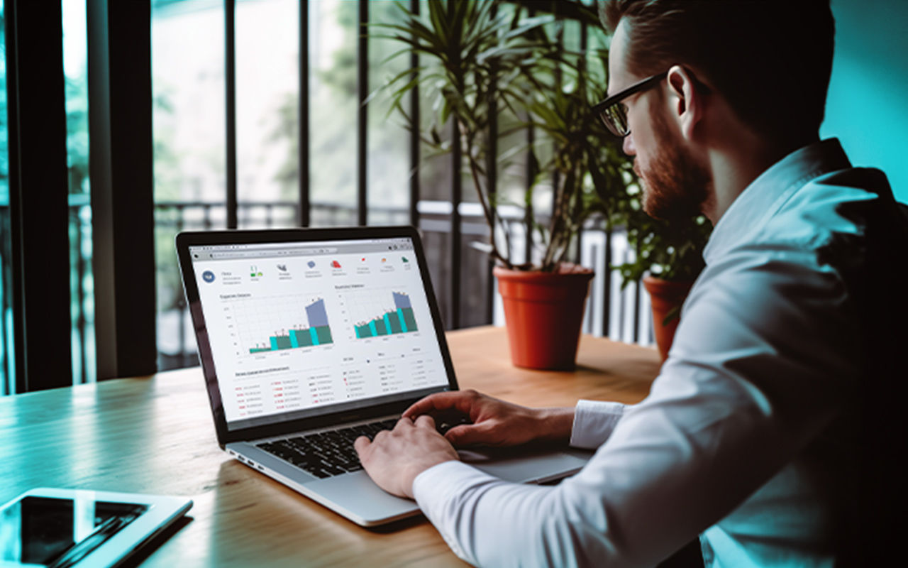 A man reviewing analytics on a laptop