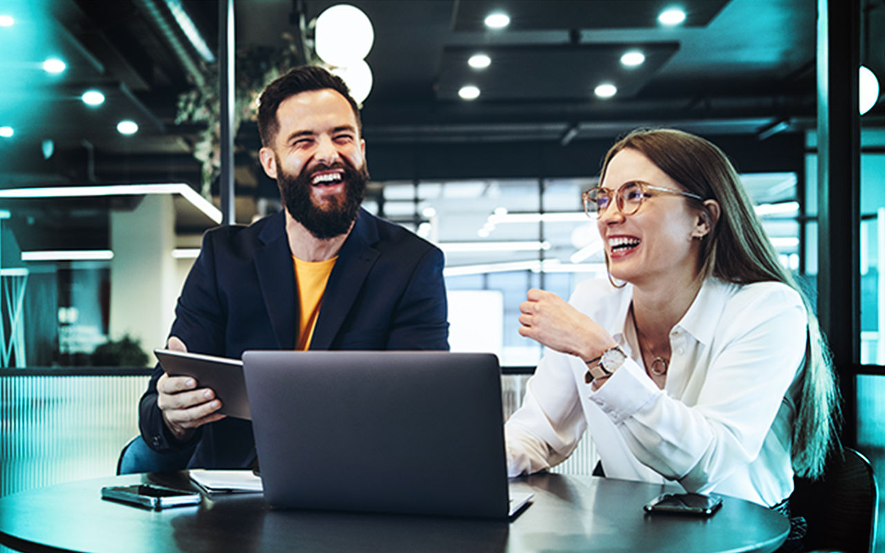Two happy people during a consulting meeting