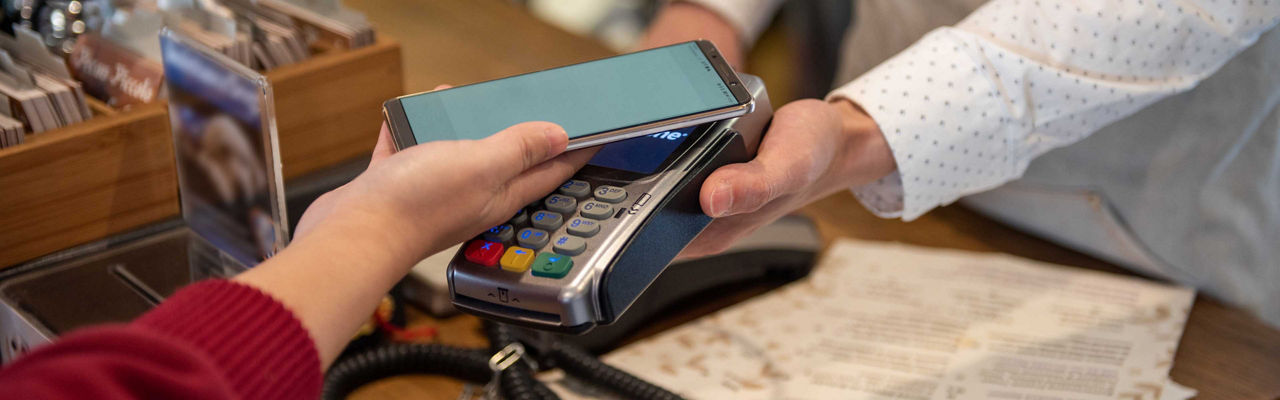 a person paying via their mobile device