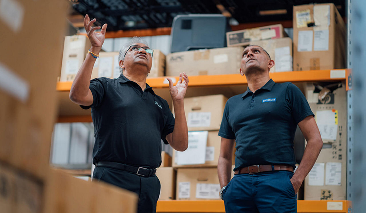 Two workers in a warehouse