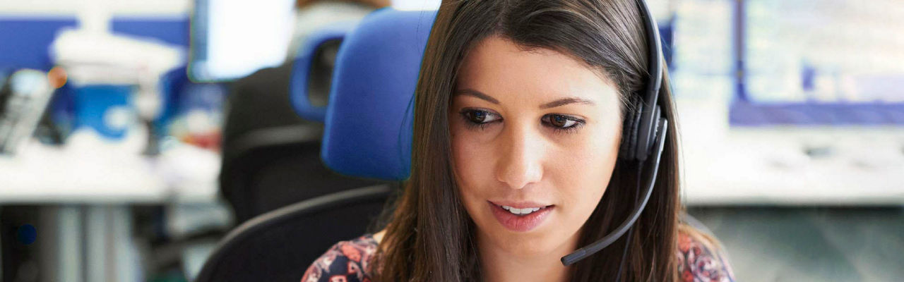 A close up shot of a female customer service representative on a call