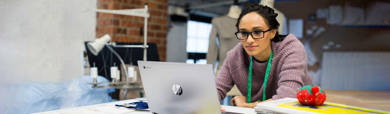 Woman using a chromebook in her work environment