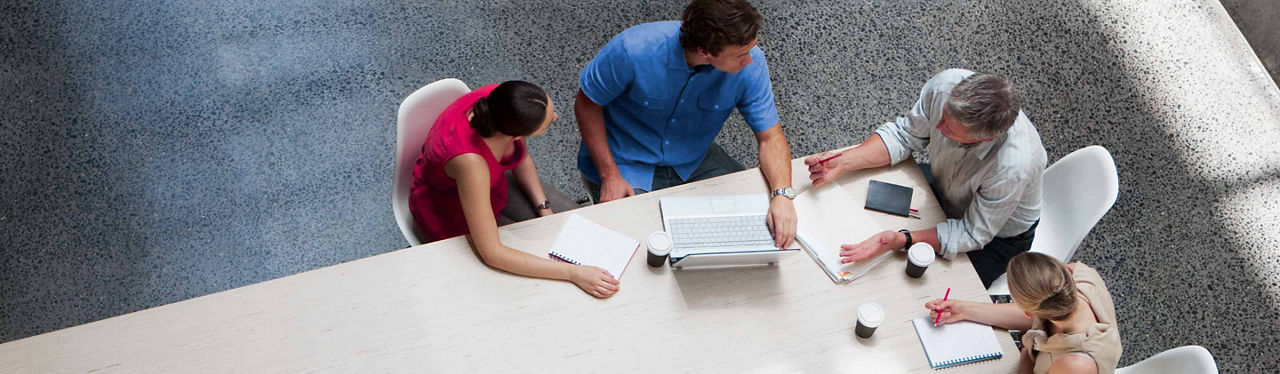 A group of people having a business discussion at a table