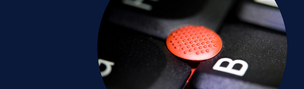 Closeup of keyboard with red button