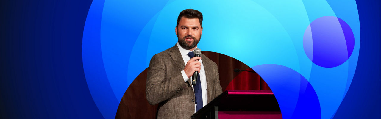 A photo of Michael Bradley speaking an at event