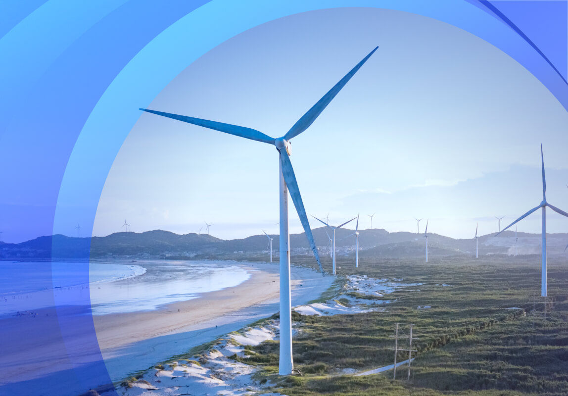 Wind turbines alongside the ocean surrounded by Datacom brand patterns.