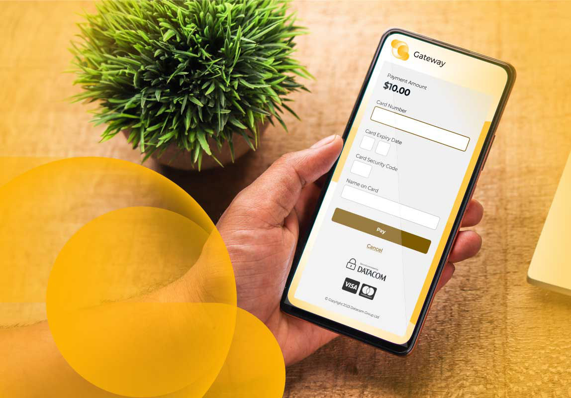A phone with a Datacom Gateway branded payment page