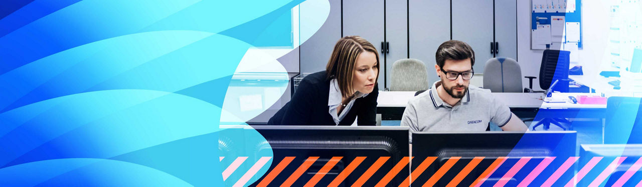 Two security specialists monitoring a screen
