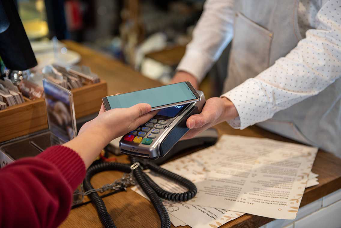 a person paying via their mobile device