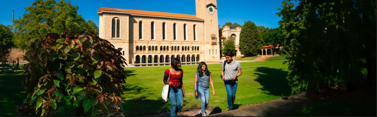 Students in front of UWA building on grass lawn