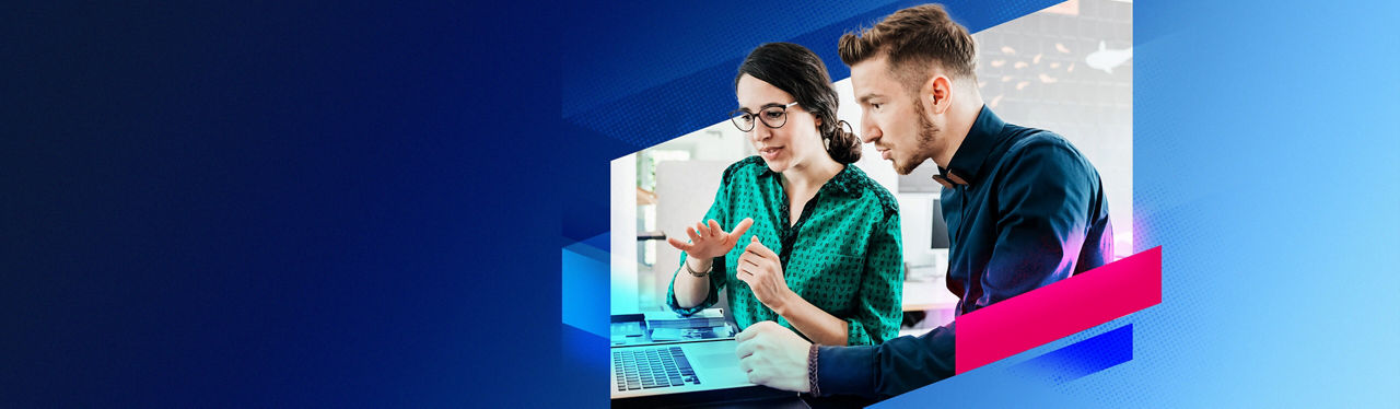 Man and woman looking at laptop