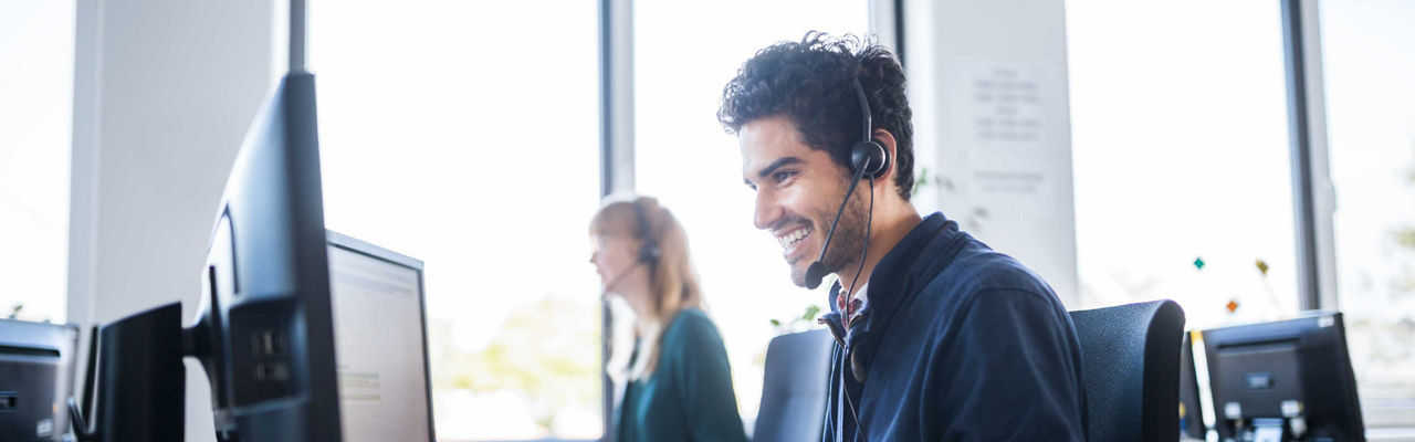 A smiling call centre employee
