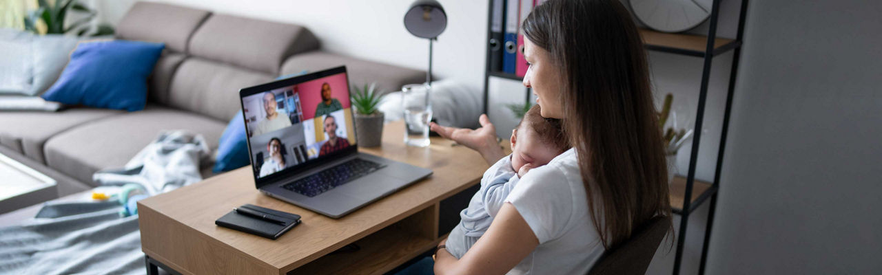 A young woman on a team call while working from home